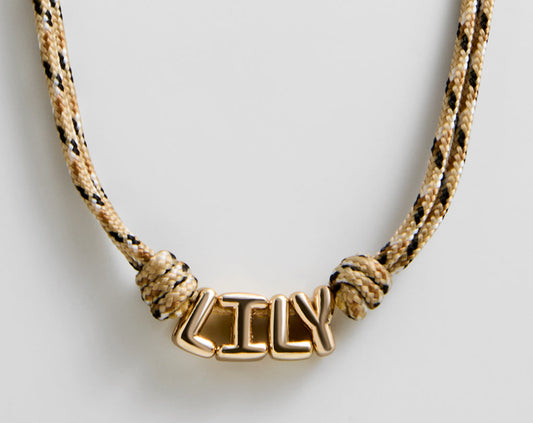 Lavisa Custom Bubble Letter Paracord Necklace with gold letters and turquoise cord