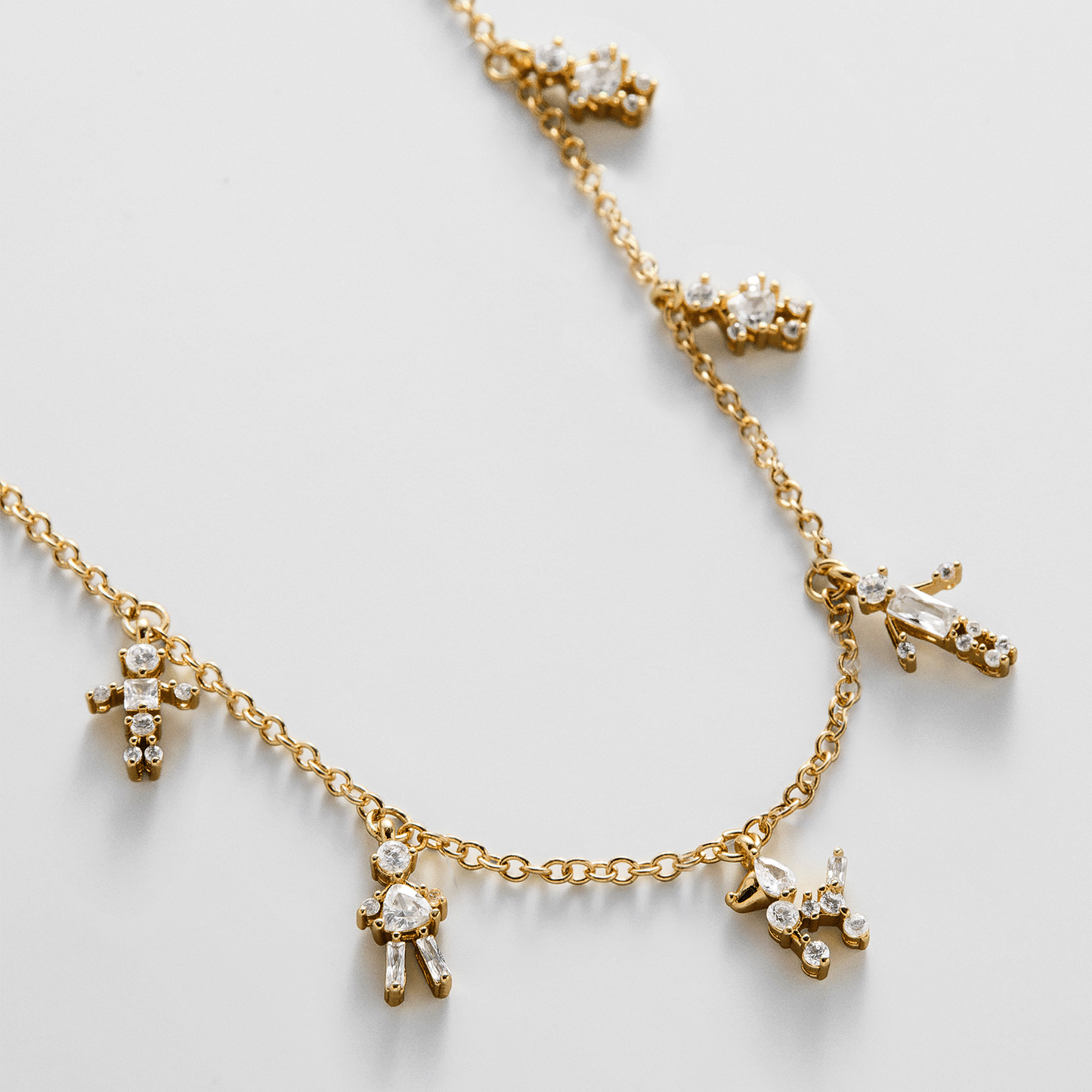Lavisa Custom Charm Necklace featuring sparkling cubic zirconia character charms on a delicate chain