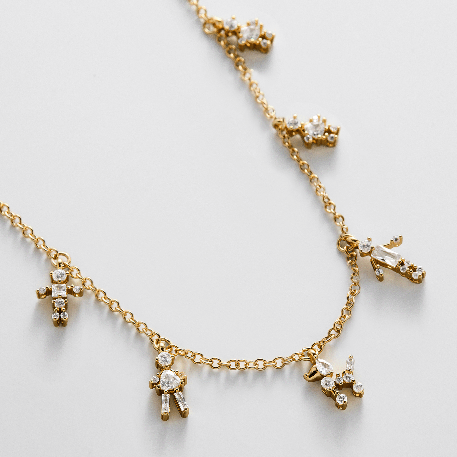 Lavisa Custom Charm Necklace featuring sparkling cubic zirconia character charms on a delicate chain