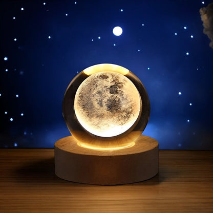 Lavisa 3D Crystal Ball Lamp glowing on a wooden base with a celestial galaxy design