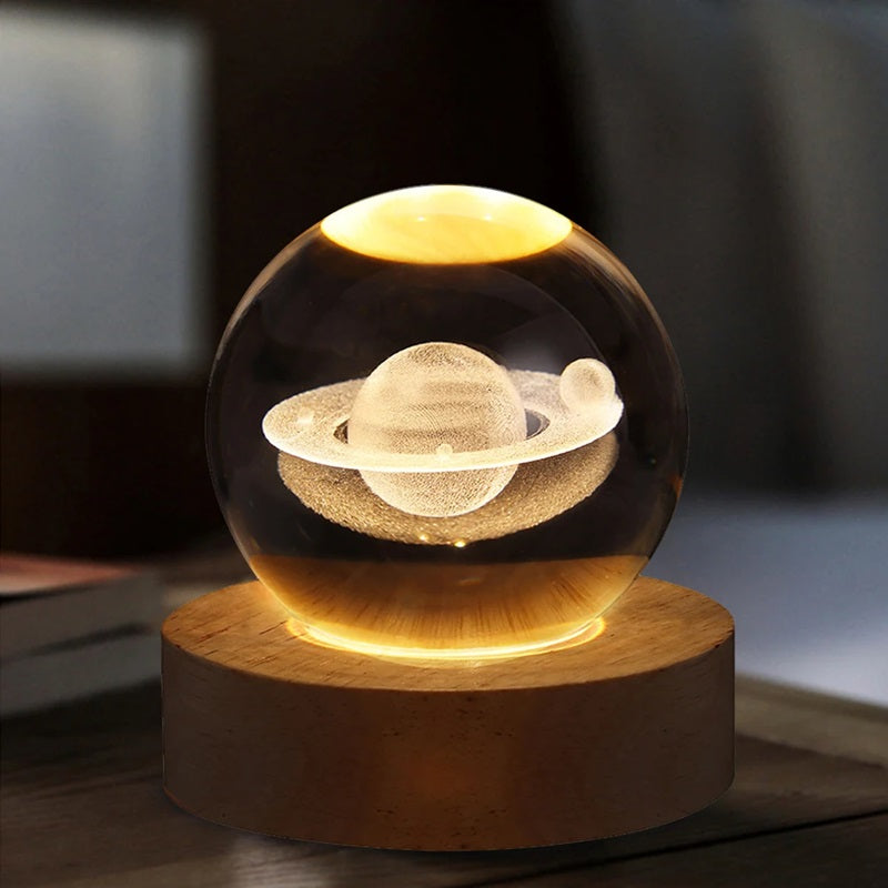 Lavisa 3D Crystal Ball Lamp glowing on a wooden base with a celestial galaxy design (View 5)