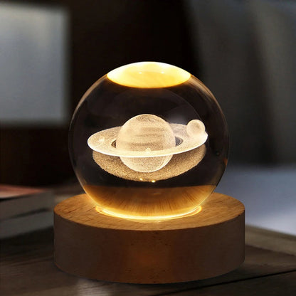 Lavisa 3D Crystal Ball Lamp glowing on a wooden base with a celestial galaxy design (View 5)