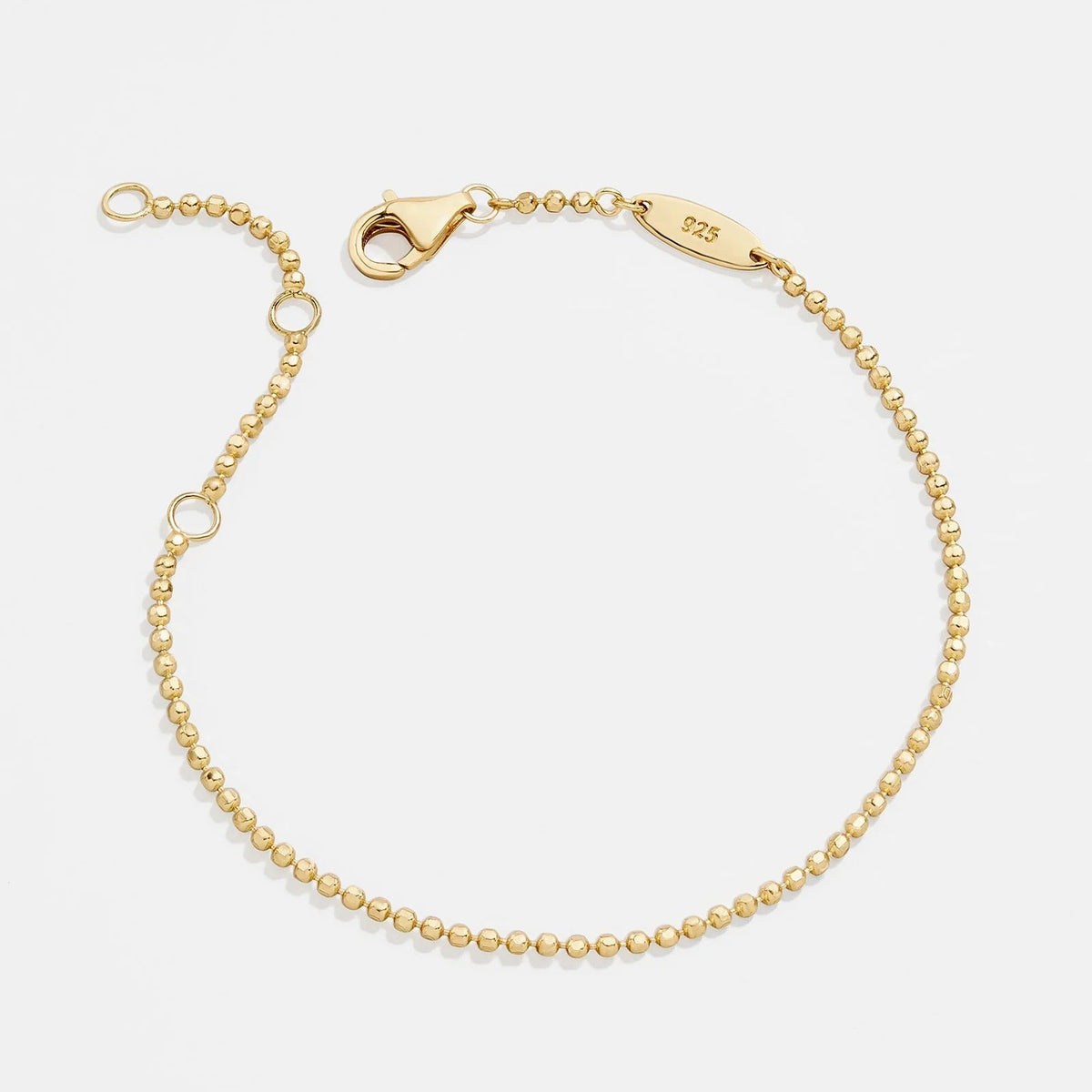 Lavisa Dainty 18K Gold Ball Bead Chain Bracelet resting on a clean neutral background