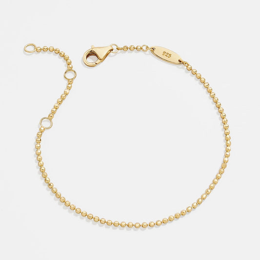 Lavisa Dainty 18K Gold Ball Bead Chain Bracelet resting on a clean neutral background