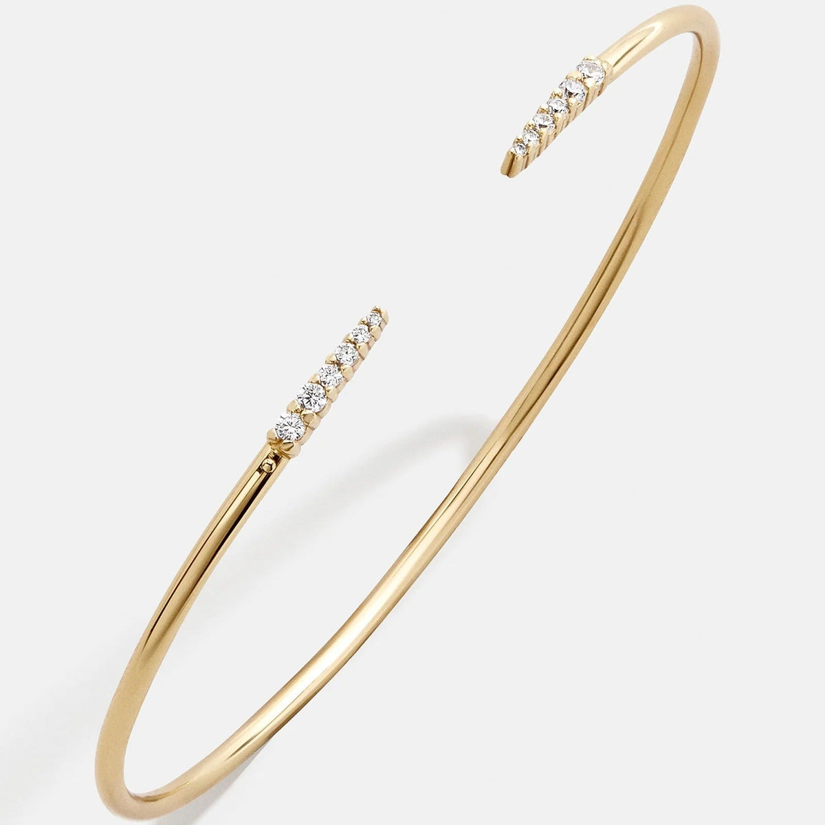 Lavisa smooth 18k gold cuff bracelet on a neutral background