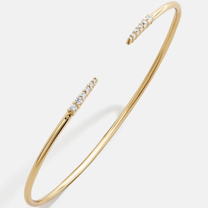 Lavisa smooth 18k gold cuff bracelet on a neutral background