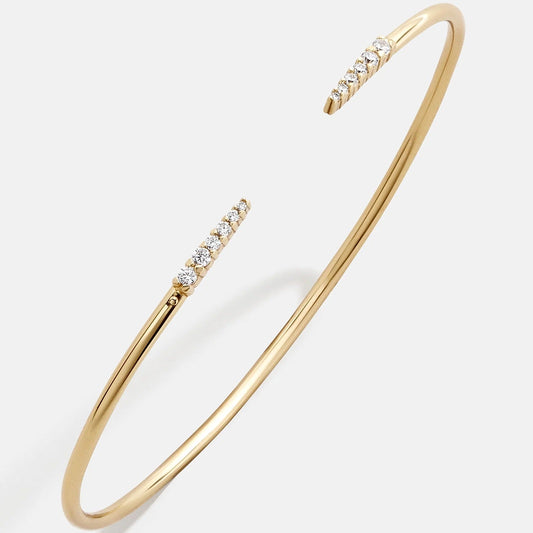 Lavisa smooth 18k gold cuff bracelet on a neutral background