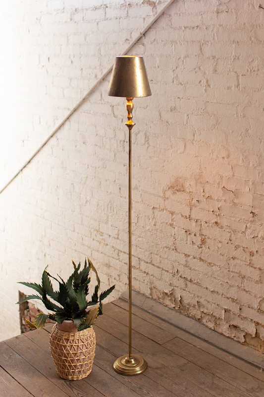 Lavisa antique gold floor lamp with metal shade standing proudly in a stylish entryway