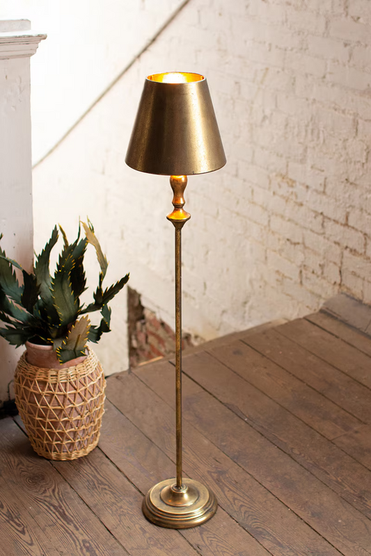 Lavisa antique gold table lamp with metal shade displayed beautifully on a mantelpiece