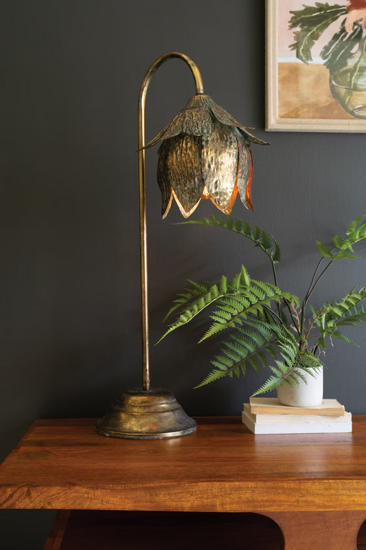 Lavisa antique brass tulip table lamp placed gracefully on a bedside nightstand