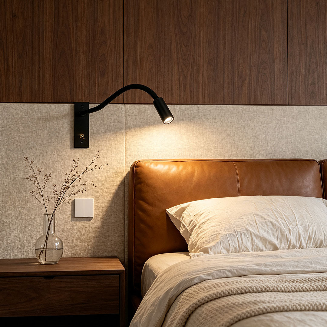 Lavisa Adjustable Swing Arm LED Wall Light mounted near a bed - Black