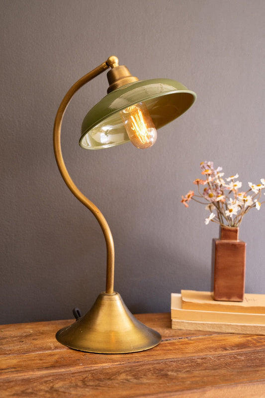 Lavisa antique brass table lamp with green enamel shade on a wooden desk