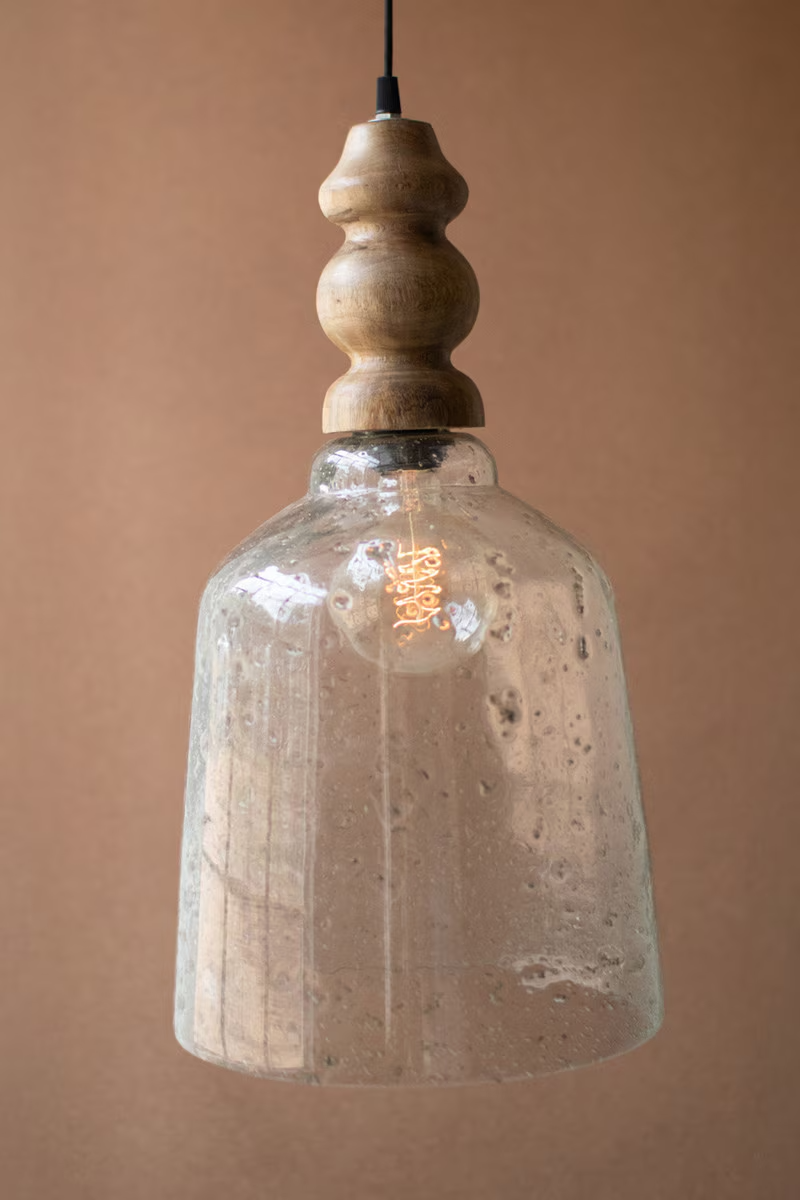 Lavisa Clear Pebbled Glass Pendant Light with Wood Finial hanging with fabric cord (View 2)
