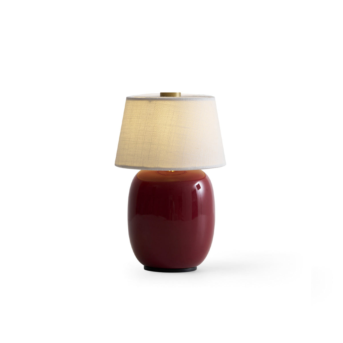 Lavisa Petite Battery Operated Table Lamp glowing on a wooden tabletop (View 7)
