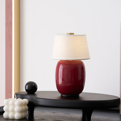 Lavisa Petite Battery Operated Table Lamp glowing on a wooden tabletop (View 8)