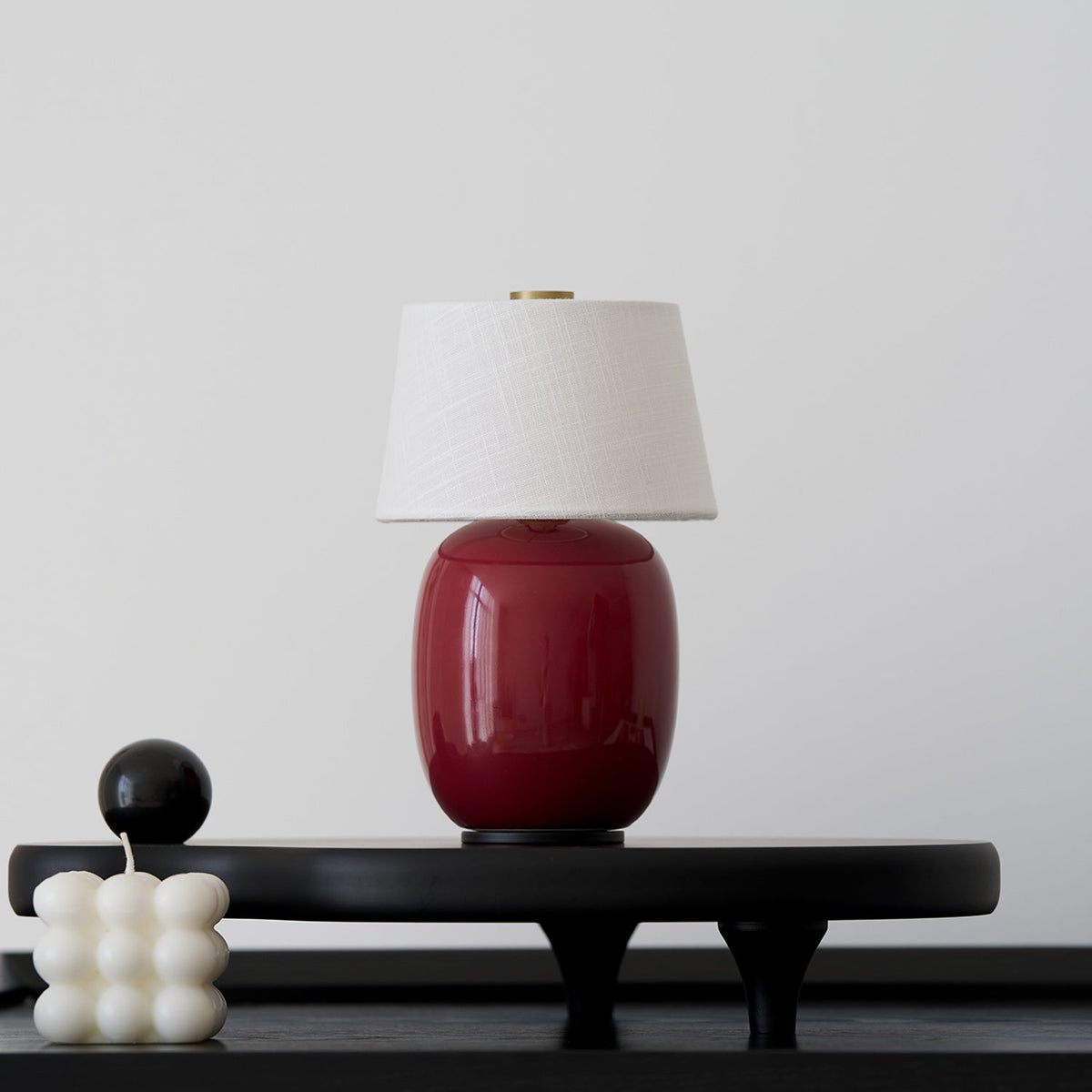 Lavisa Petite Battery Operated Table Lamp glowing on a wooden tabletop (View 9)