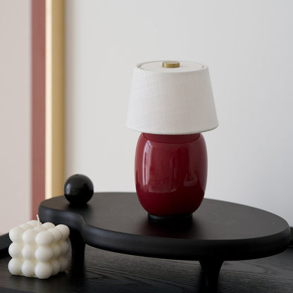 Lavisa Petite Battery Operated Table Lamp glowing on a wooden tabletop (View 10)
