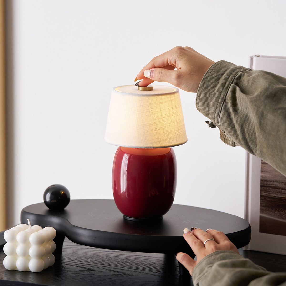 Lavisa Petite Battery Operated Table Lamp glowing on a wooden tabletop (View 5)