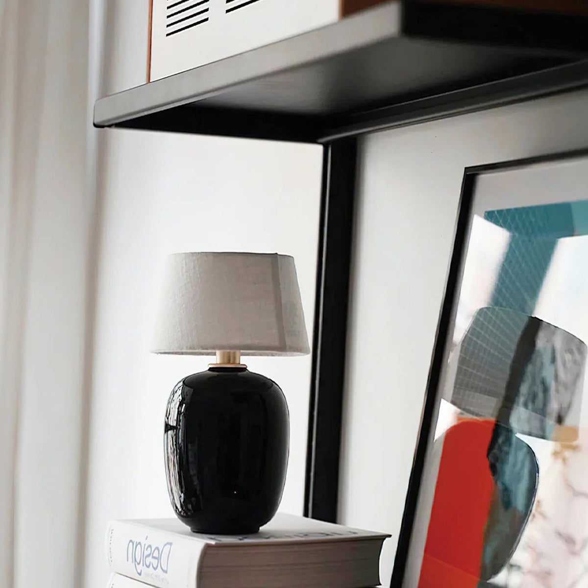 Lavisa Petite Battery Operated Table Lamp glowing on a wooden tabletop (View 11)
