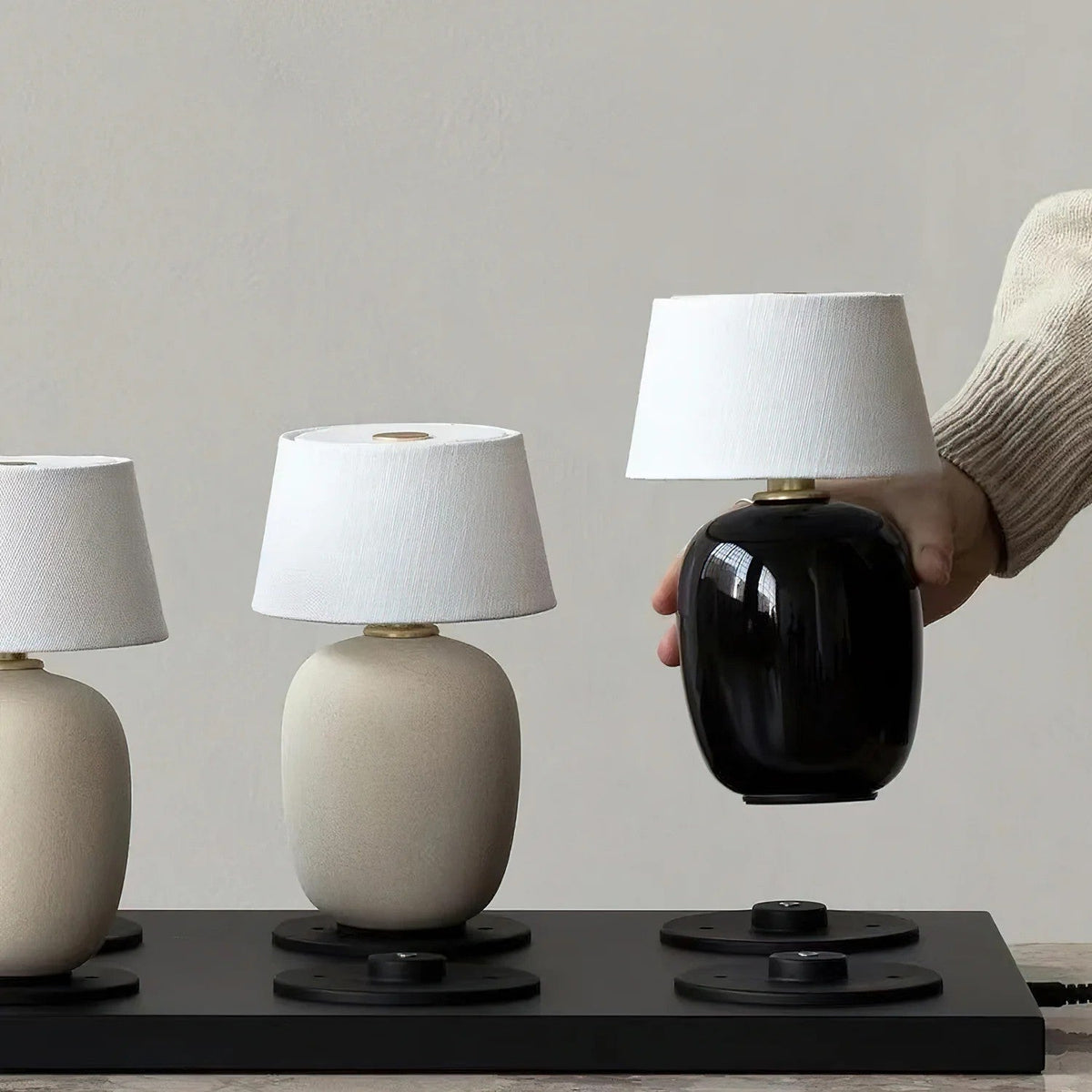 Lavisa Petite Battery Operated Table Lamp glowing on a wooden tabletop (View 6)