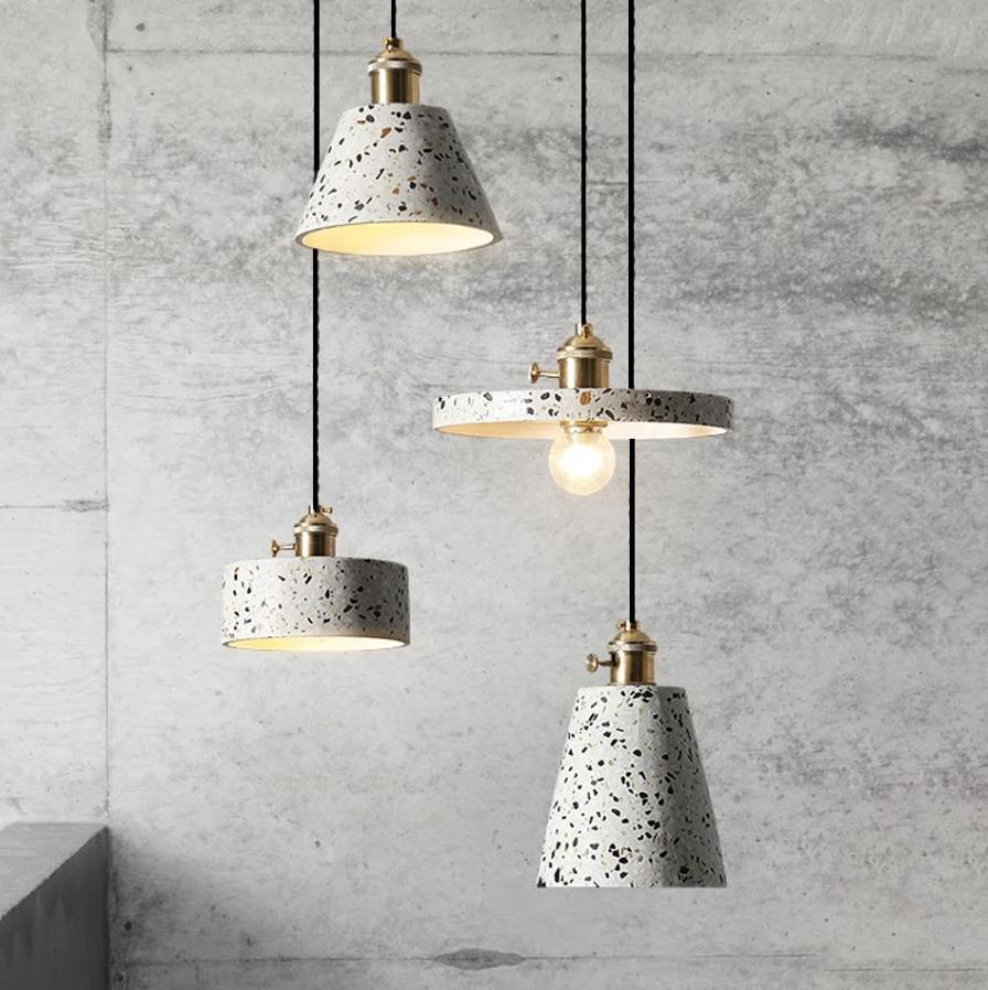 Lavisa Postmodern Terrazzo Pendant Light hanging over a modern dining table - Cubic