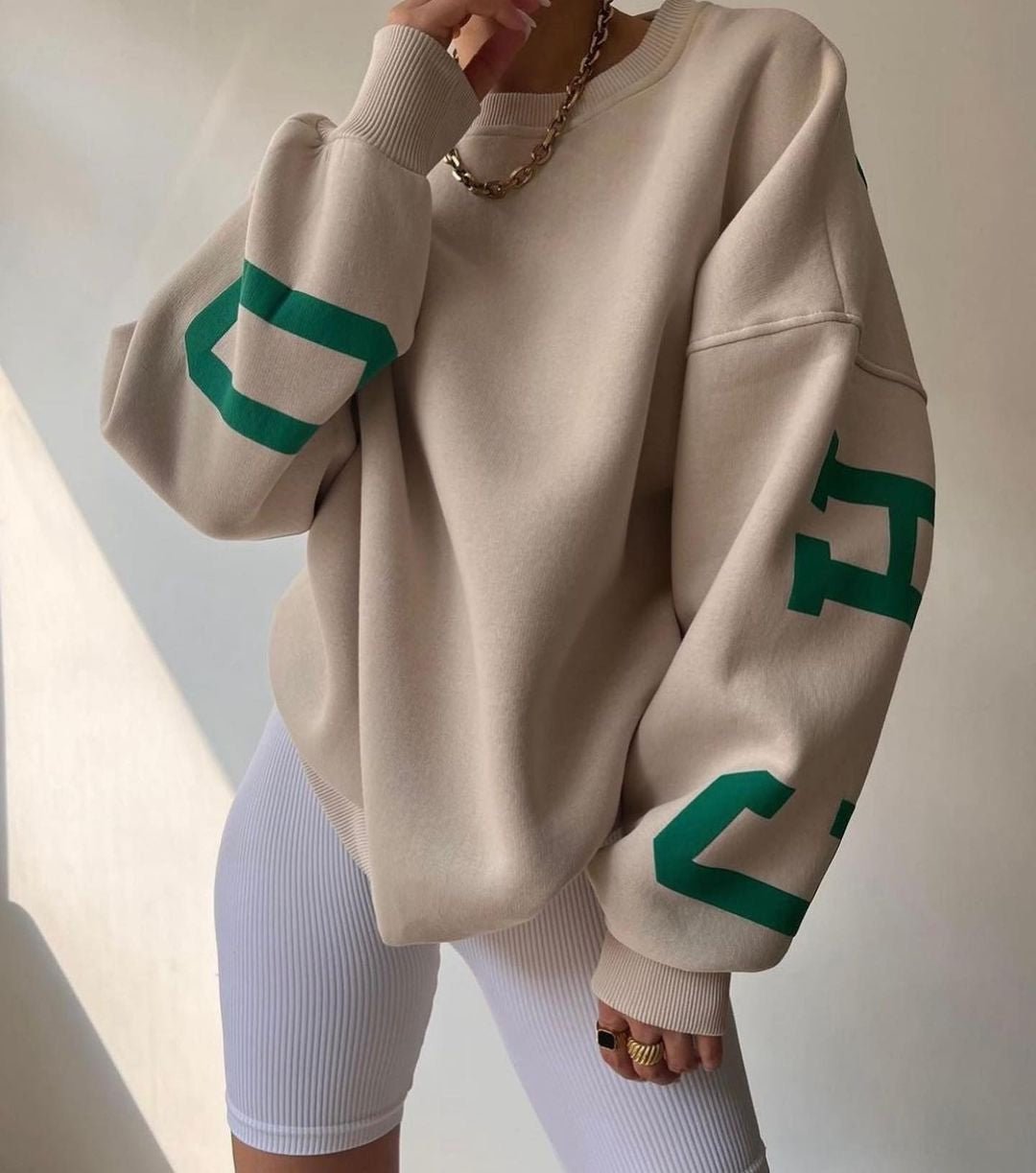 Women's Oversized Fleece-Lined Varsity Sleeve Crewneck Jumper - Close-Up Texture & Detail | Lavisa
